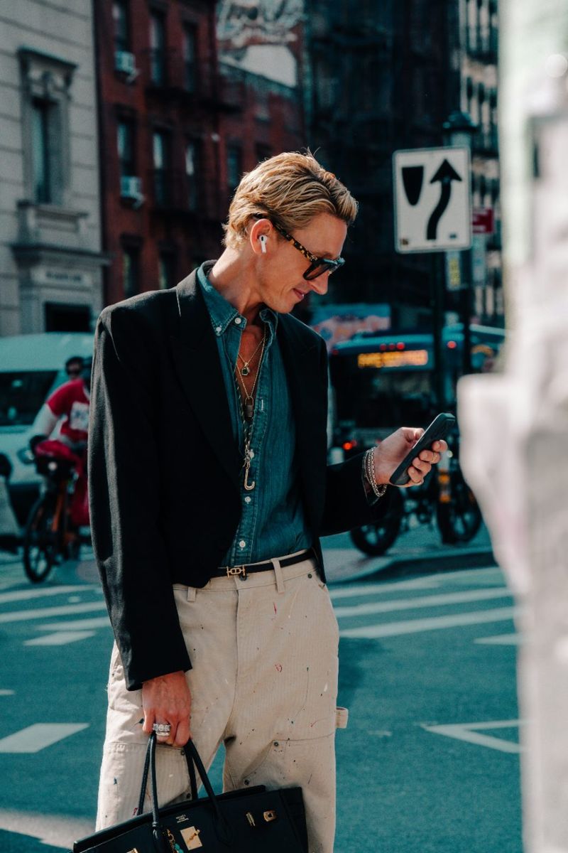Man reading a report on his phone
